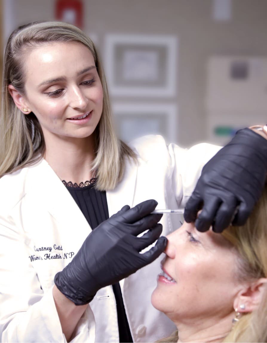 White Orchid Spa staff member injecting patients eyebrow area