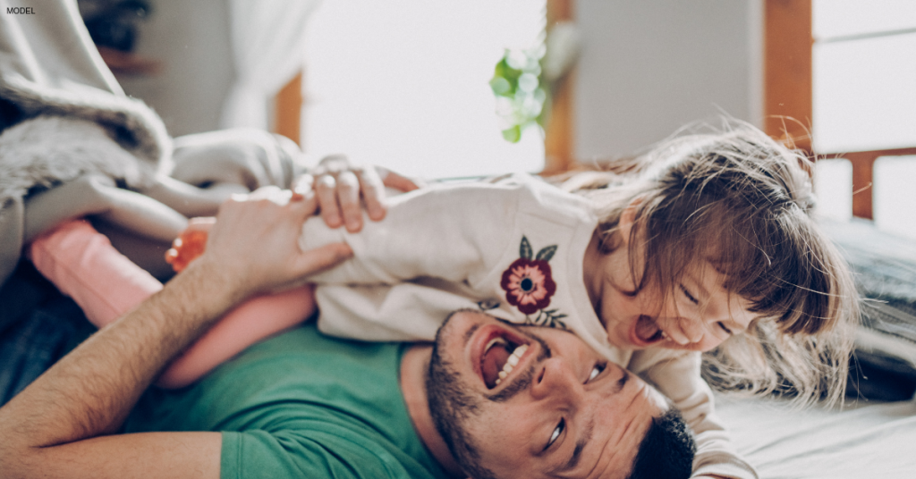 Dad playing with daughter after a relaxing massage